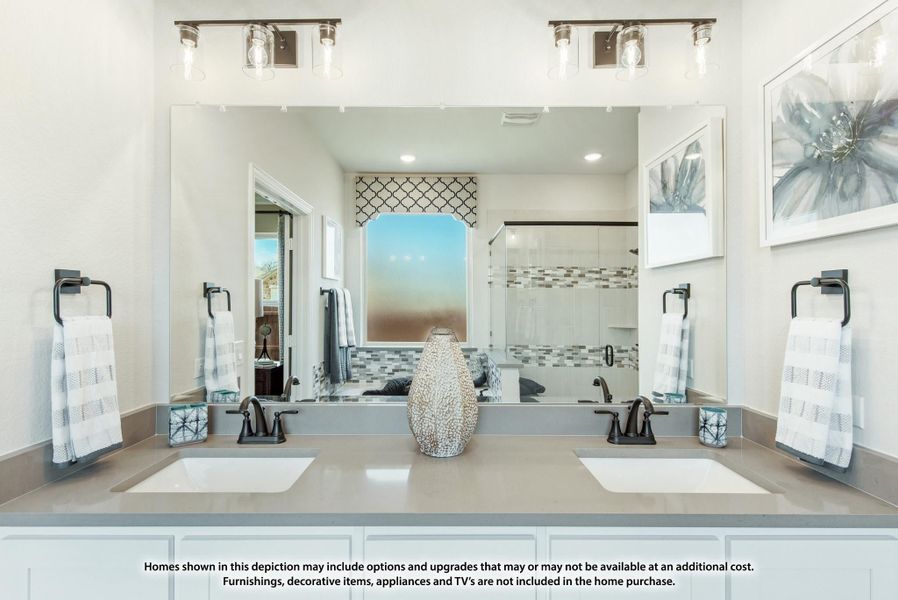 Bathroom with double sink vanity, large mirror, white cabinets, and glass shower visible in reflection