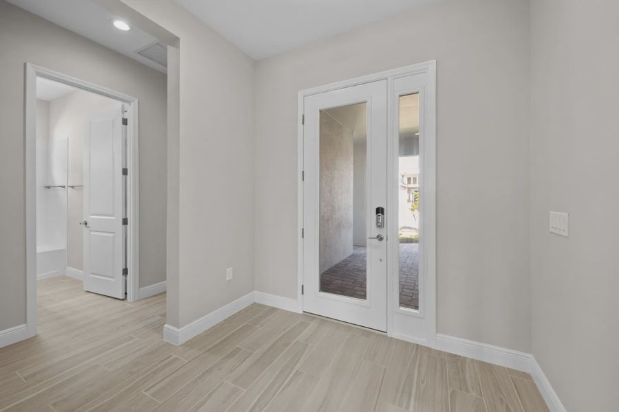 Representative unfurnished interior of a home built from the Eventide 4 by Neal Communities in SkySail, Naples (Image 11).
