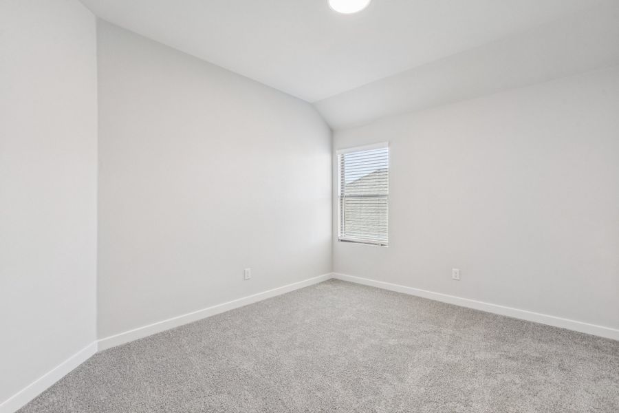 Bedroom in the Winters home plan by Trophy Signature Homes – REPRESENTATIVE PHOTO