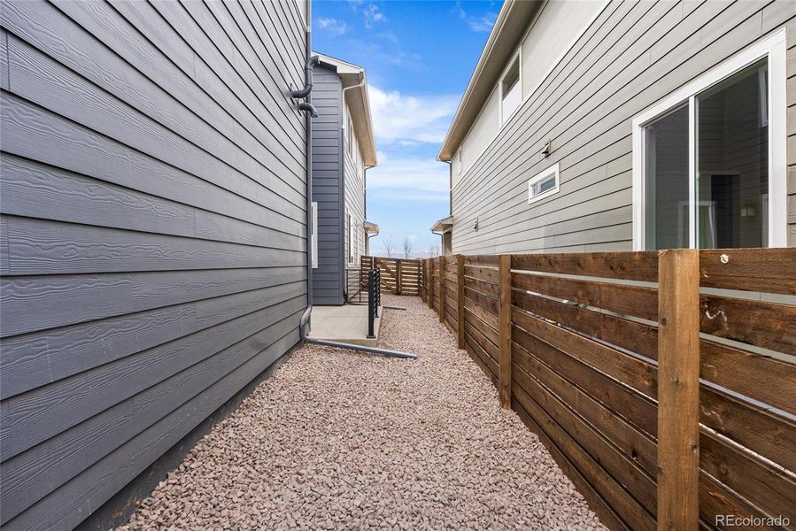 Exterior details and patio area of a home in Barefoot Village, Firestone (Image 20).
