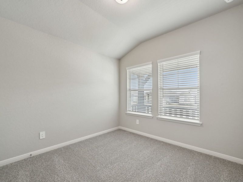Guest bedroom in the Briscoe floorplan at a Meritage Homes community. Guest bedroom in the Briscoe floorplan at a Meritage Homes community.