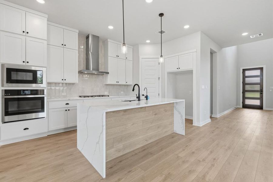 Furnished interior view inside a new home in Heritage, Dripping Springs (Image 4).