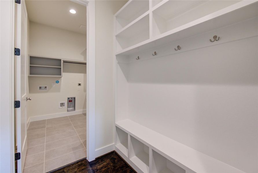 Mud room is connected to the laundry room and next to the garage