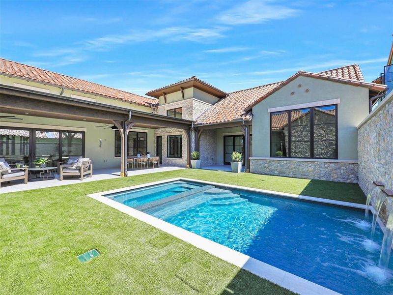 View of pool featuring a yard, ceiling fan, a patio area, and an outdoor hangout area