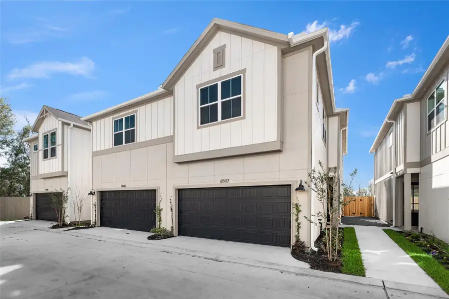 Clean board-and-batten exterior and a private two-car garage give the home a finished, intentional look from the street. Clean board-and-batten exterior and a private two-car garage give the home a finished, intentional look from the street.