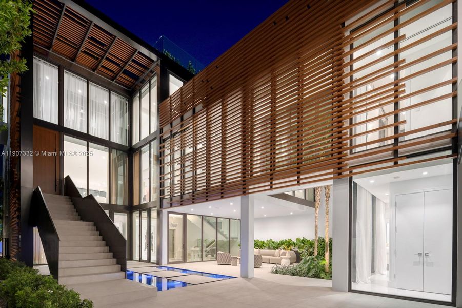 Exterior details and patio area of a home in , Miami Beach (Image 34). Exterior details and patio area of a home in , Miami Beach (Image 34).