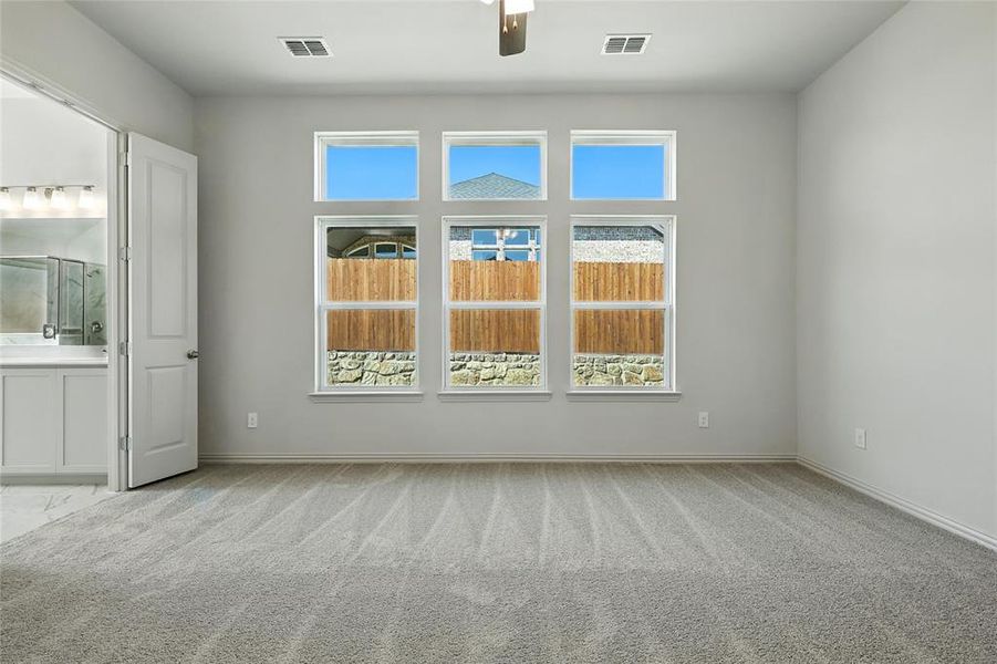 Full bath featuring a marble finish shower, a garden tub, marble finish flooring, double vanity, and lofted ceiling Full bath featuring a marble finish shower, a garden tub, marble finish flooring, double vanity, and lofted ceiling