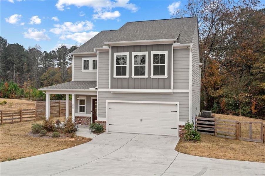 Front exterior of a new home in , Auburn, GA, highlighting curb appeal (Image 1).