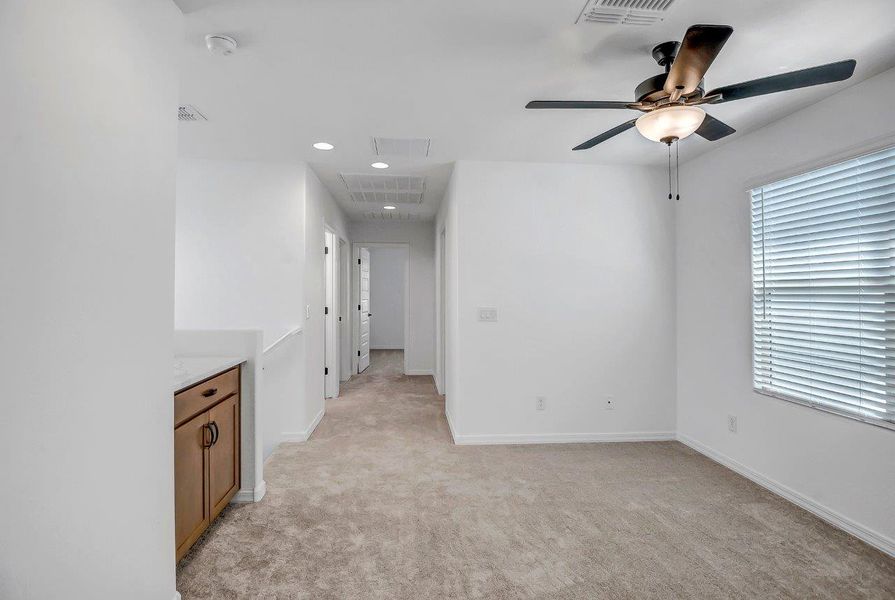 Spacious, unfurnished interior of a new home in Ironwood Villages at North Creek, Queen Creek (Image 19).