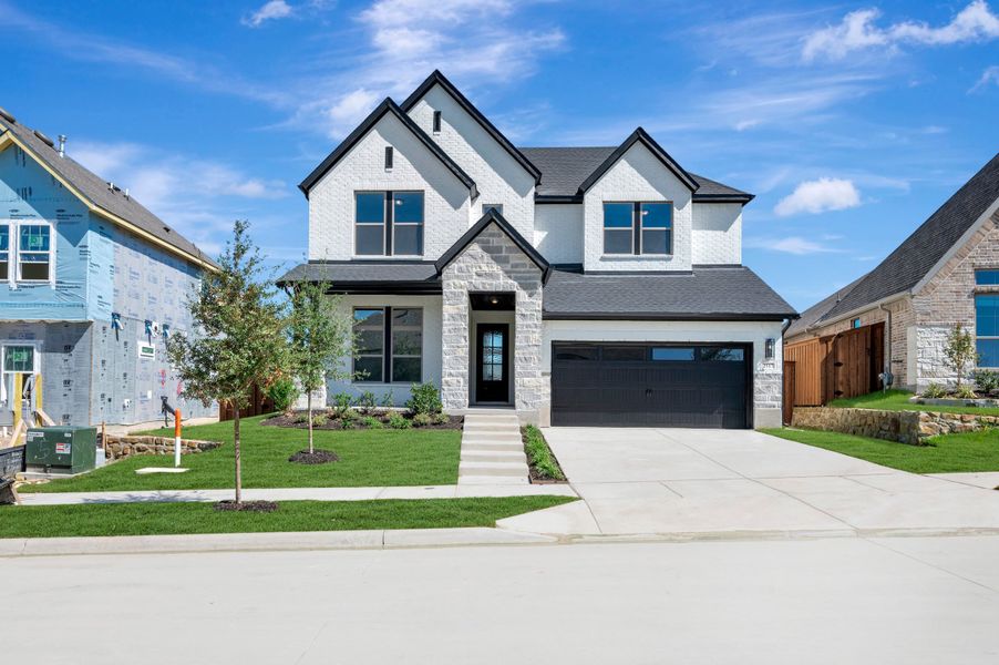 Front exterior of a new home in Walsh Classic, Fort Worth, TX, highlighting curb appeal (Image 1). Front exterior of a new home in Walsh Classic, Fort Worth, TX, highlighting curb appeal (Image 1).