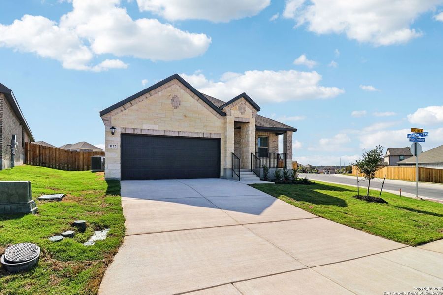 Front exterior of a new home in Arcadia Ridge - Premier Series, San Antonio, TX, highlighting curb appeal (Image 2). Front exterior of a new home in Arcadia Ridge - Premier Series, San Antonio, TX, highlighting curb appeal (Image 2).