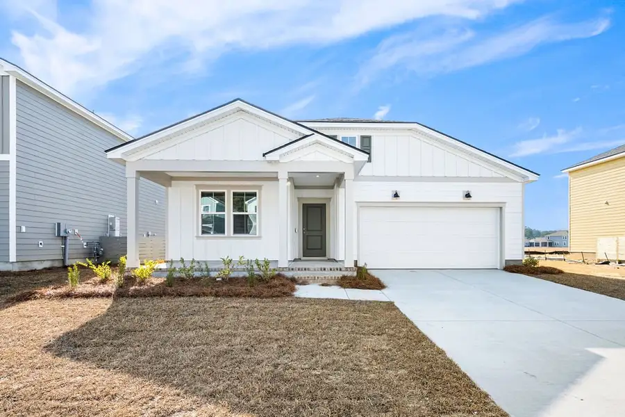 Front exterior of a new home in Heartwood, Richmond Hill, GA, highlighting curb appeal (Image 1). Front exterior of a new home in Heartwood, Richmond Hill, GA, highlighting curb appeal (Image 1).