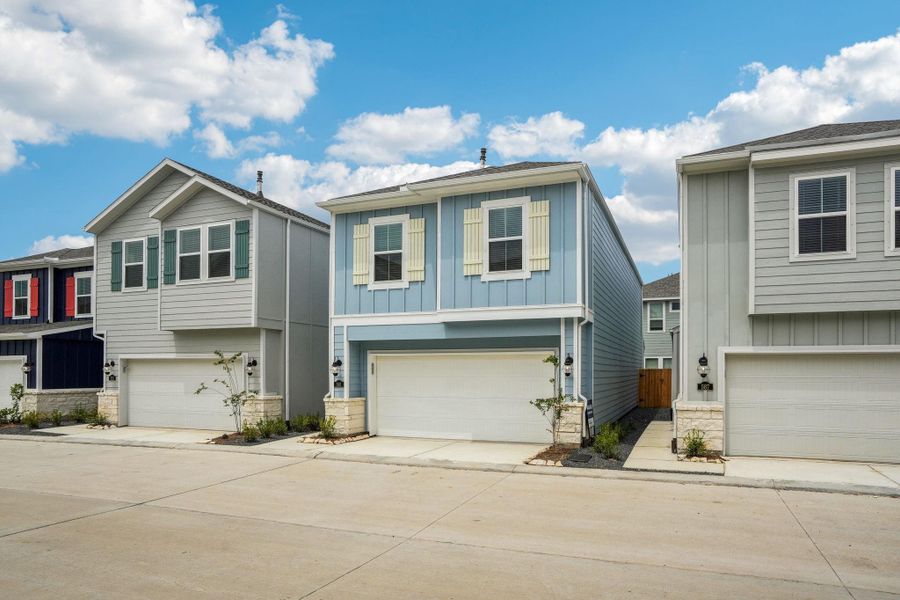 Front exterior of a new home in Kemah Crossing - City Series, Kemah, TX, highlighting curb appeal (Image 29). Front exterior of a new home in Kemah Crossing - City Series, Kemah, TX, highlighting curb appeal (Image 29).