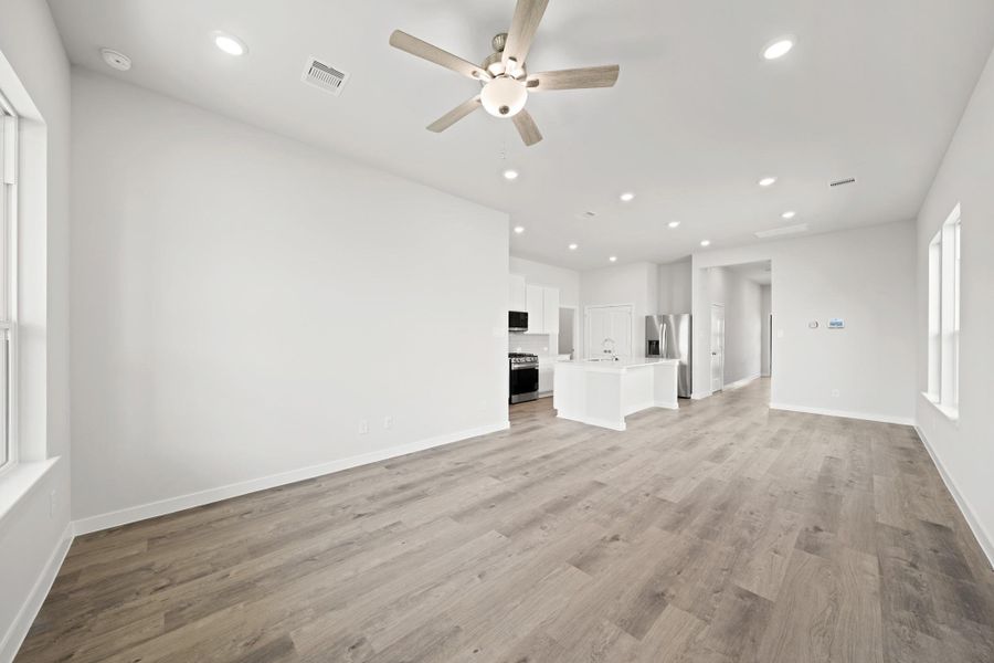Spacious, unfurnished interior of a new home in Creekland Village at Bridgeland, Cypress (Image 20).
