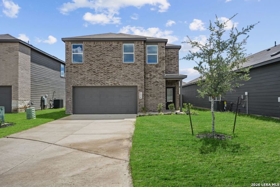 Front exterior of a new home in Vida, San Antonio, TX, highlighting curb appeal (Image 1). Front exterior of a new home in Vida, San Antonio, TX, highlighting curb appeal (Image 1).