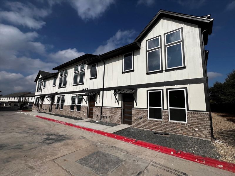 In-progress construction of a new home in Koenig Townhomes, Austin, TX (Image 12).