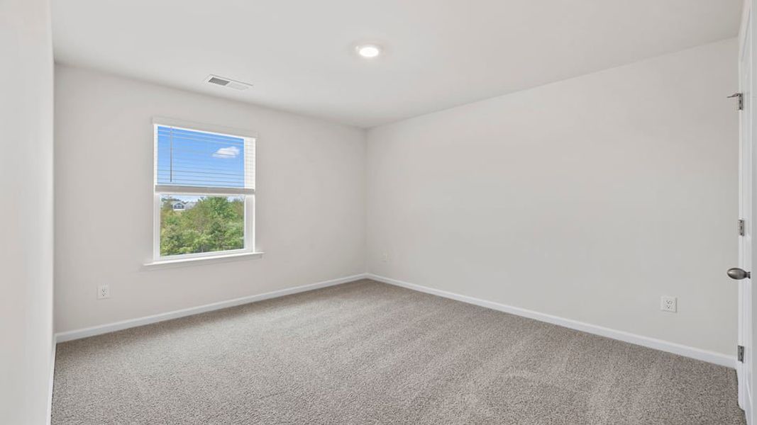 Spacious, unfurnished interior of a new home in Bentley Park, Greenwood (Image 20).