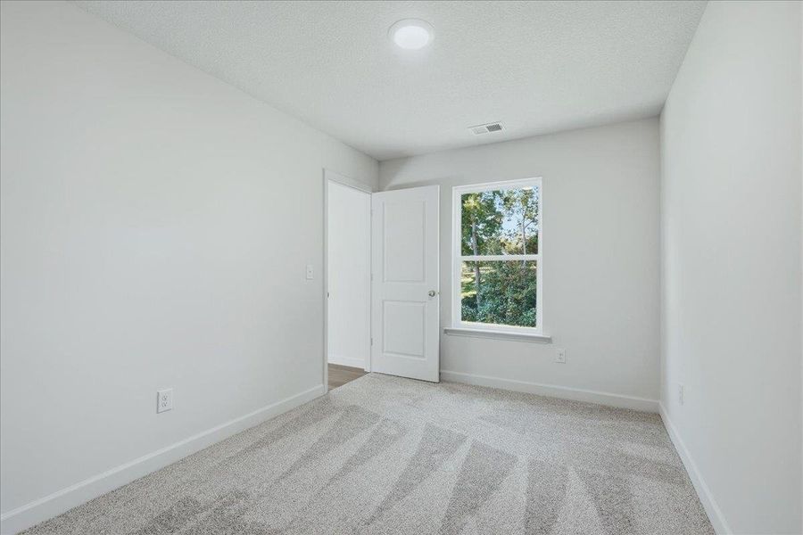 Spacious, unfurnished interior of a new home in Stones Throw, Inman (Image 24).