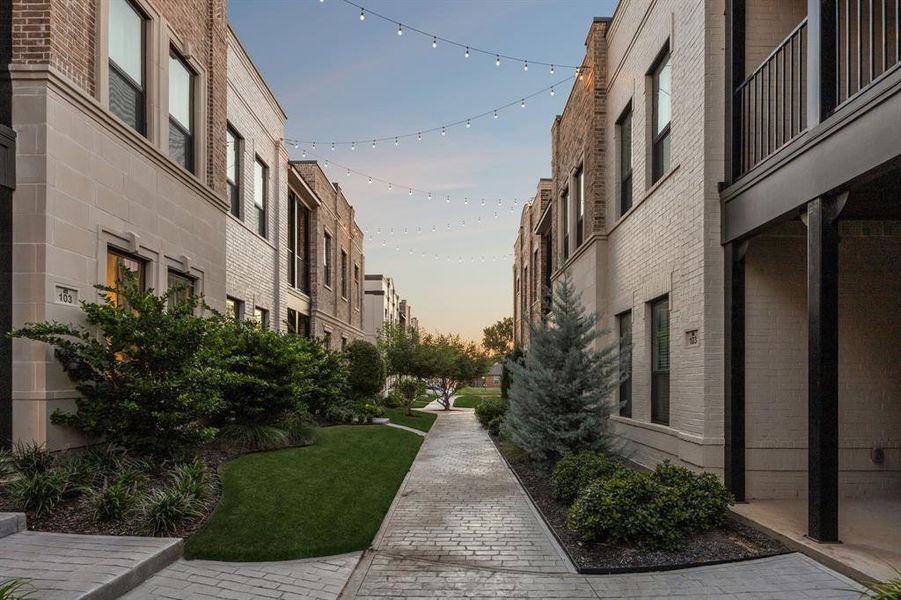 Beautiful string lights between buildings in The Parkland.