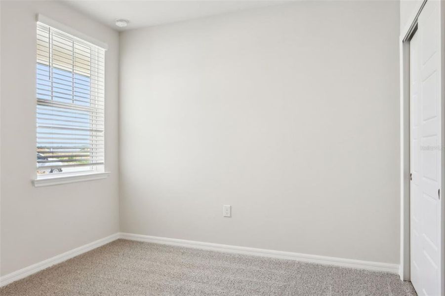 Spacious, unfurnished interior of a new home in Crescent Lakes - Premier Series, Punta Gorda (Image 13).