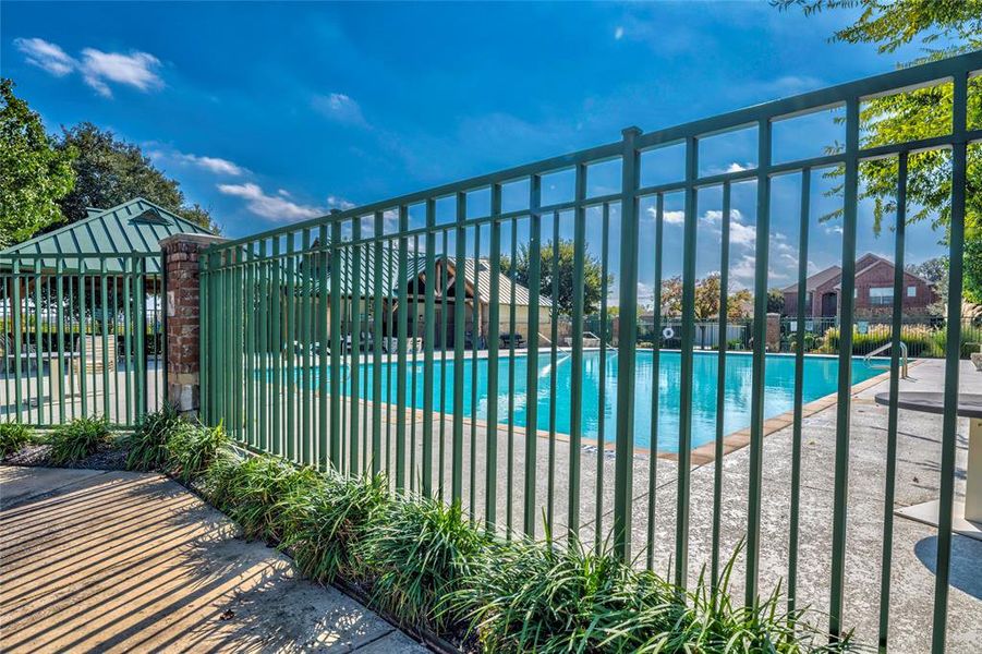 Community pool with a patio Community pool with a patio