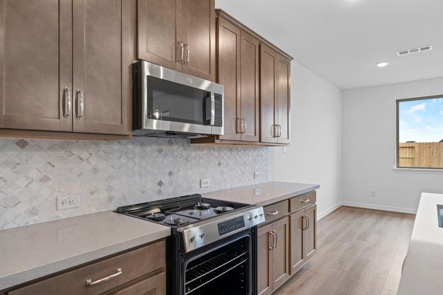This kitchen is not only a functional space but also has ample storage. Whether you're a seasoned chef or just love to gather and enjoy good food, this kitchen is a dream come true.