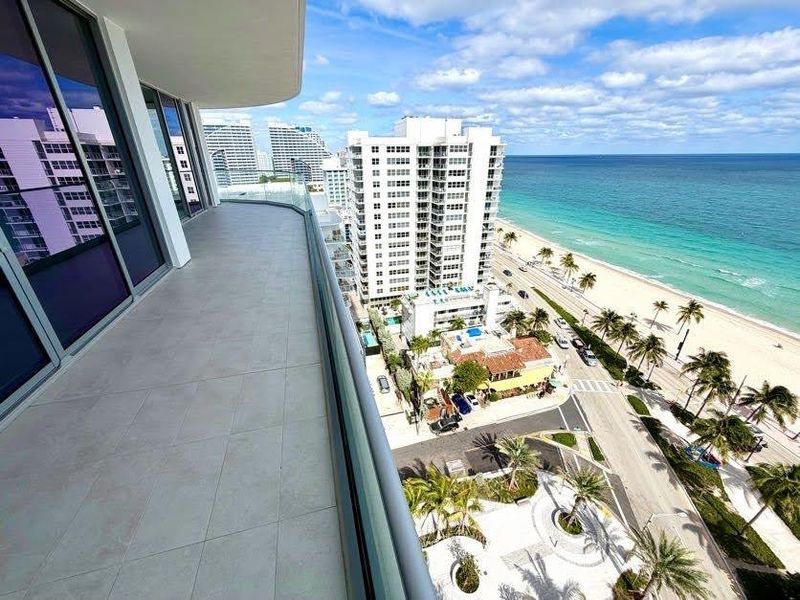 Balcony off the living room with ocean-facing views.