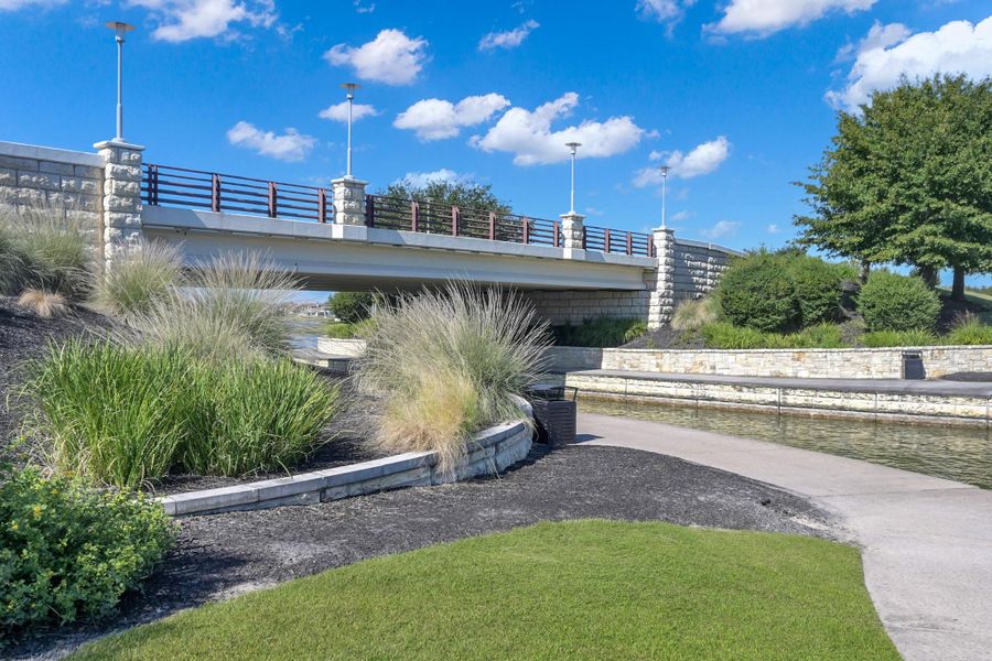 There are wide walkways leading to the Boardwalk of Towne Lake.