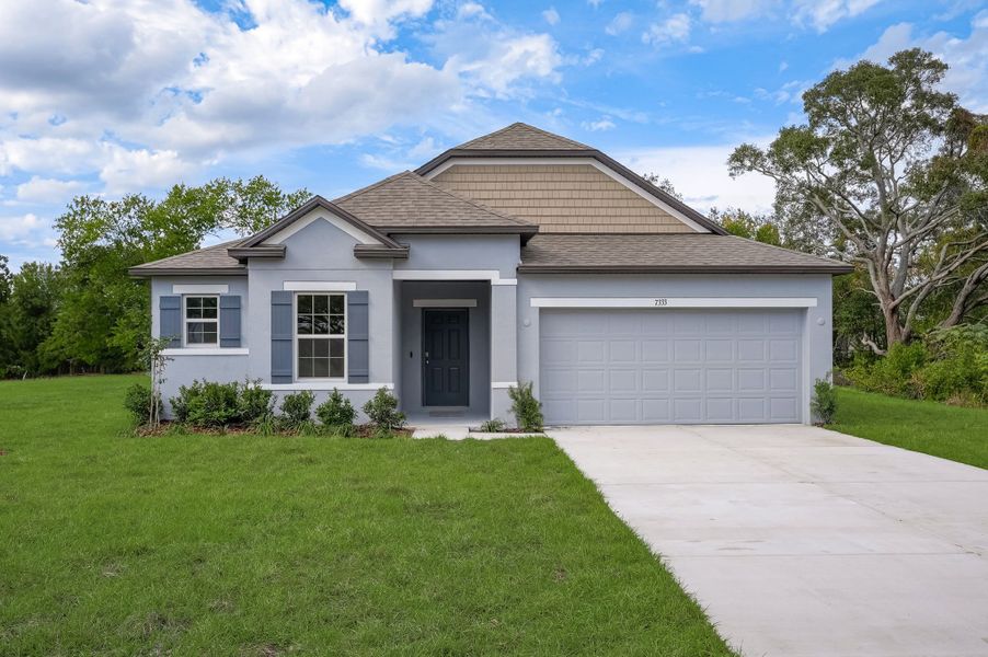 Front exterior of a new home in Silver Springs Shores, Ocala, FL, highlighting curb appeal (Image 23). Front exterior of a new home in Silver Springs Shores, Ocala, FL, highlighting curb appeal (Image 23).