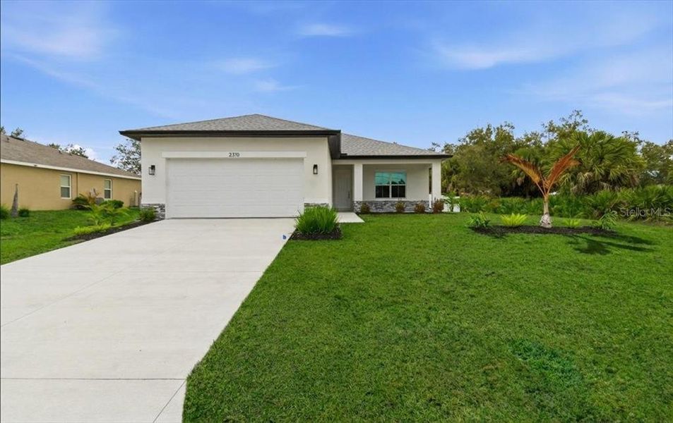 Front exterior of a new home in , North Port, FL, highlighting curb appeal (Image 30).