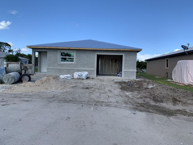 Front exterior of a new home in , Fort Pierce, FL, highlighting curb appeal (Image 1). Front exterior of a new home in , Fort Pierce, FL, highlighting curb appeal (Image 1).