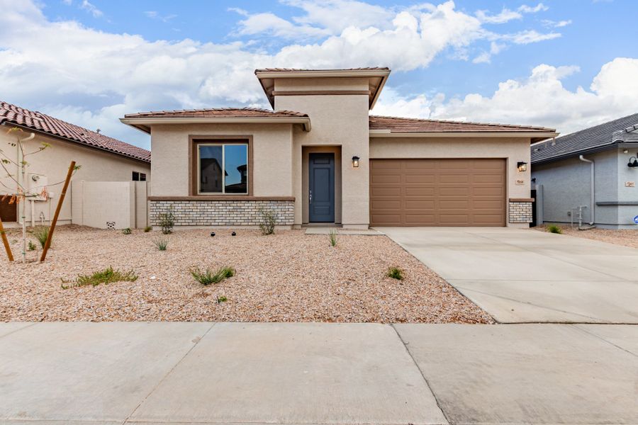 Front exterior of a new home in Wildera, Queen Creek, AZ, highlighting curb appeal (Image 1). Front exterior of a new home in Wildera, Queen Creek, AZ, highlighting curb appeal (Image 1).