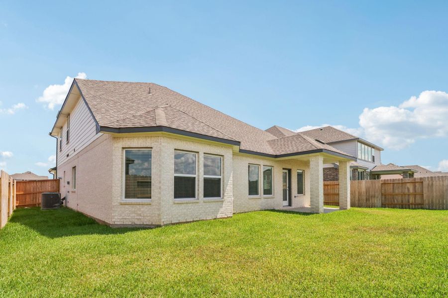 Front exterior of a new home in Kingdom Heights, Rosenberg, TX, highlighting curb appeal (Image 1). Front exterior of a new home in Kingdom Heights, Rosenberg, TX, highlighting curb appeal (Image 1).