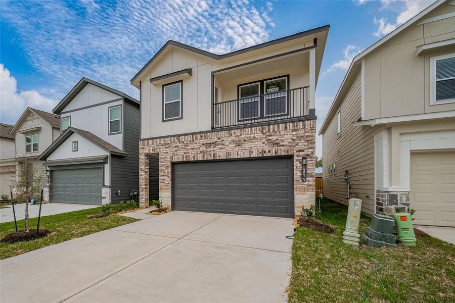 Front exterior of a new home in Eagle Landing, Houston, TX, highlighting curb appeal (Image 2). Front exterior of a new home in Eagle Landing, Houston, TX, highlighting curb appeal (Image 2).