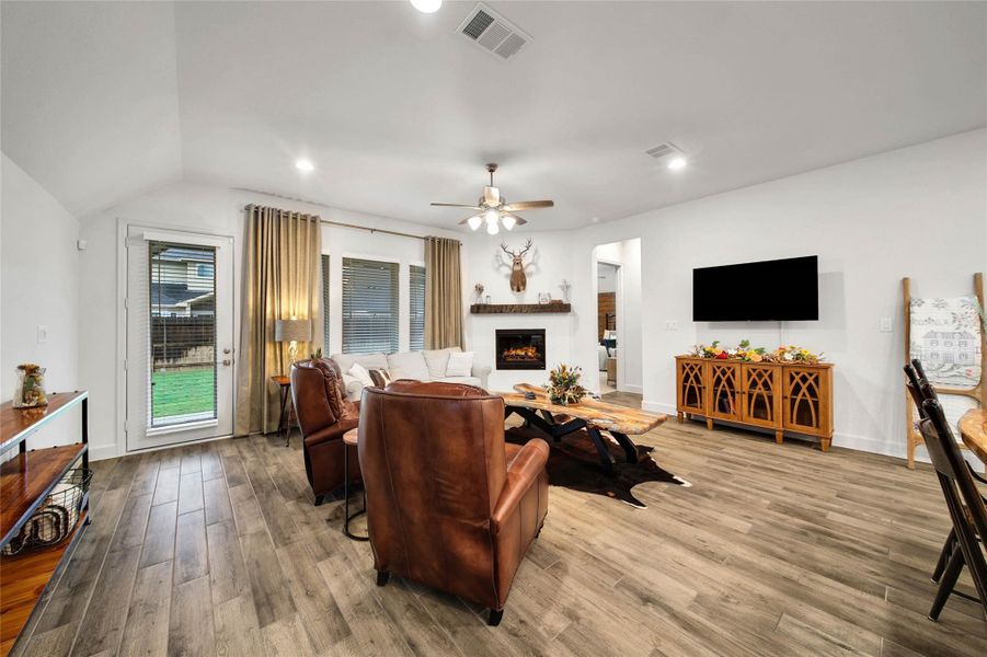 Generous dimensions make this family room  well-suited for everyday relaxation or entertaining, with plenty of space for family & friends to gather.