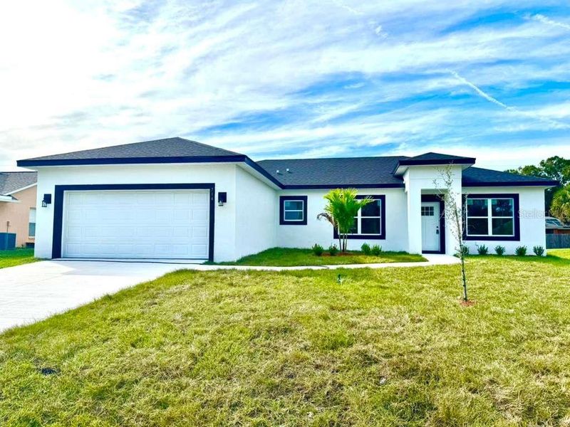 Front exterior of a new home in , Palm Bay, FL, highlighting curb appeal (Image 25).