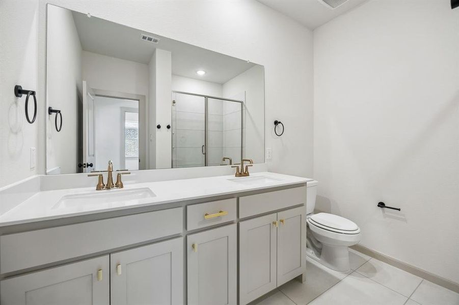 Friends and family will feel right at home in any of the beautifully finished guest baths in our Giselle plan.