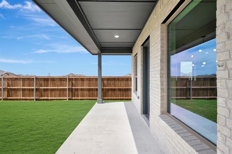 Fenced backyard with a patio Fenced backyard with a patio