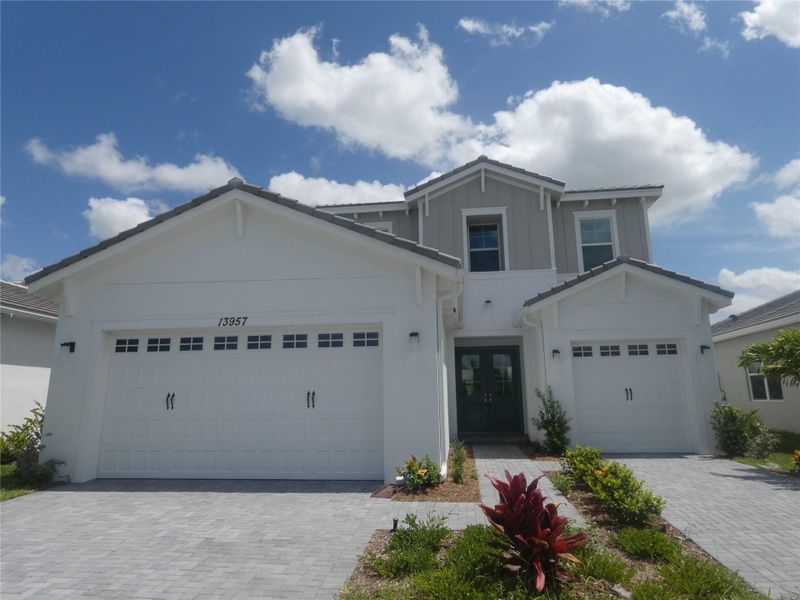 Front exterior of a new home in , Westlake, FL, highlighting curb appeal (Image 23).