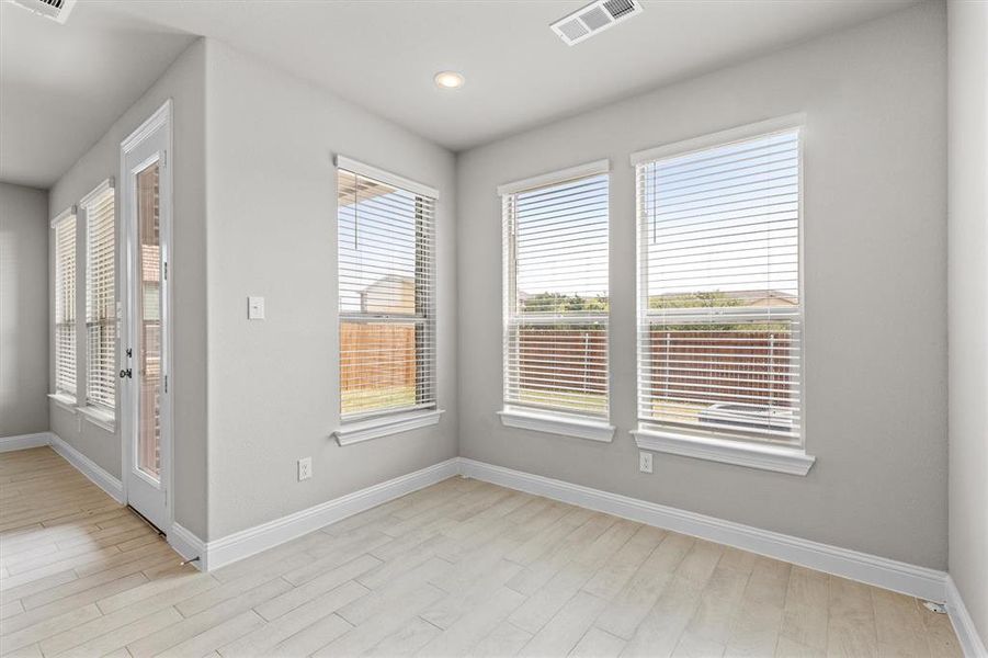 Unfurnished room featuring light hardwood / wood-style floors