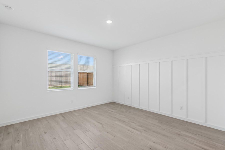 Spacious primary suite with feature wall Spacious primary suite with feature wall