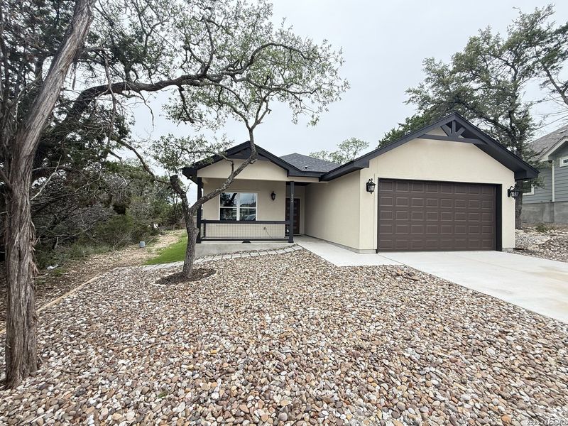 Front exterior of a new home in , Spring Branch, TX, highlighting curb appeal (Image 21).