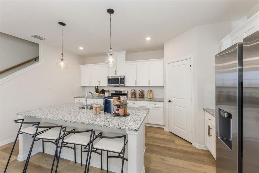A beautiful crisp clean white color palette and modern flooring effortlessly pair with contemporary stainless steel to create a kitchen for the ages! A beautiful crisp clean white color palette and modern flooring effortlessly pair with contemporary stainless steel to create a kitchen for the ages!