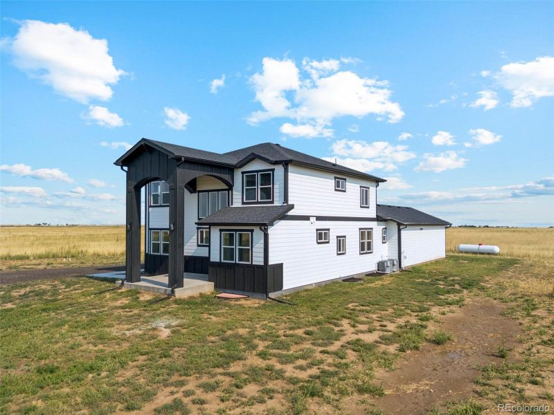 Front exterior of a new home in , Bennett, CO, highlighting curb appeal (Image 26).