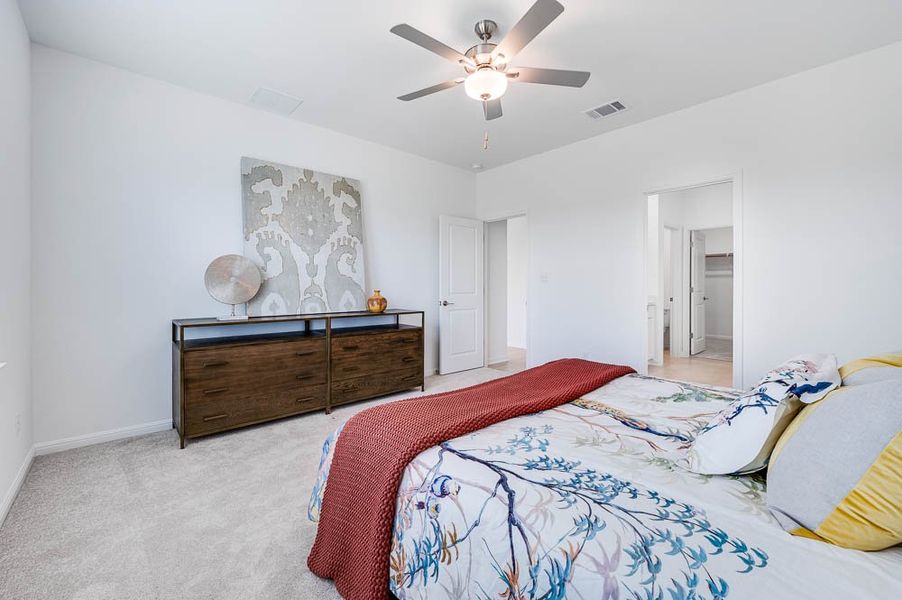 Representative furnished interior of a home built from the Sparrow by Taylor Morrison in Turner's Crossing 50s, Austin (Image 11).