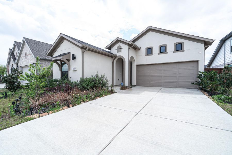 Front exterior of a new home in , Katy, TX, highlighting curb appeal (Image 1). Front exterior of a new home in , Katy, TX, highlighting curb appeal (Image 1).