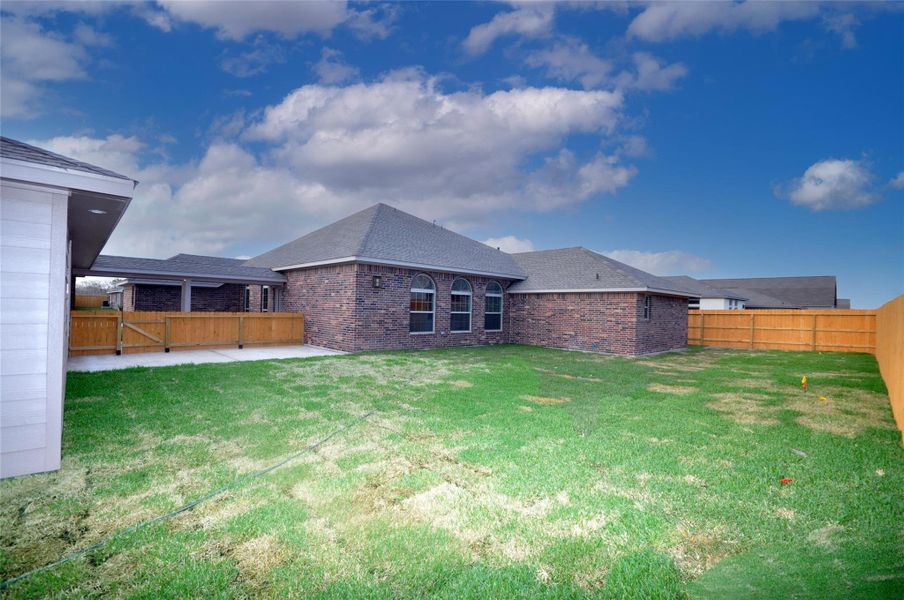 Spacious and fully fenced rear yard. Spacious and fully fenced rear yard.