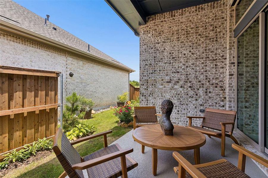 Exterior details and patio area of a home in Elements at Viridian - Garden Series, Arlington (Image 25).