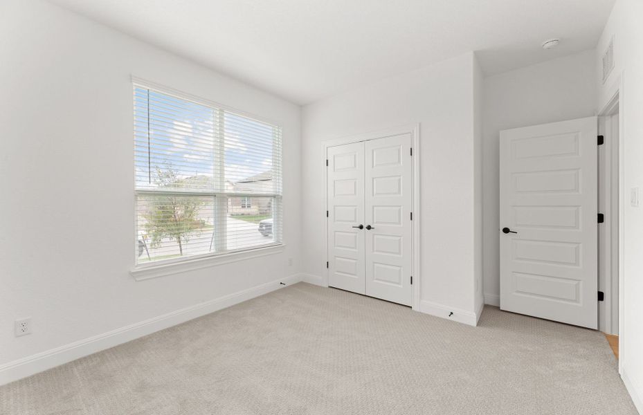 Representative unfurnished interior of a home built from the Orchard by Pulte Homes in Saddleback at Santa Rita Ranch, Liberty Hill (Image 14).