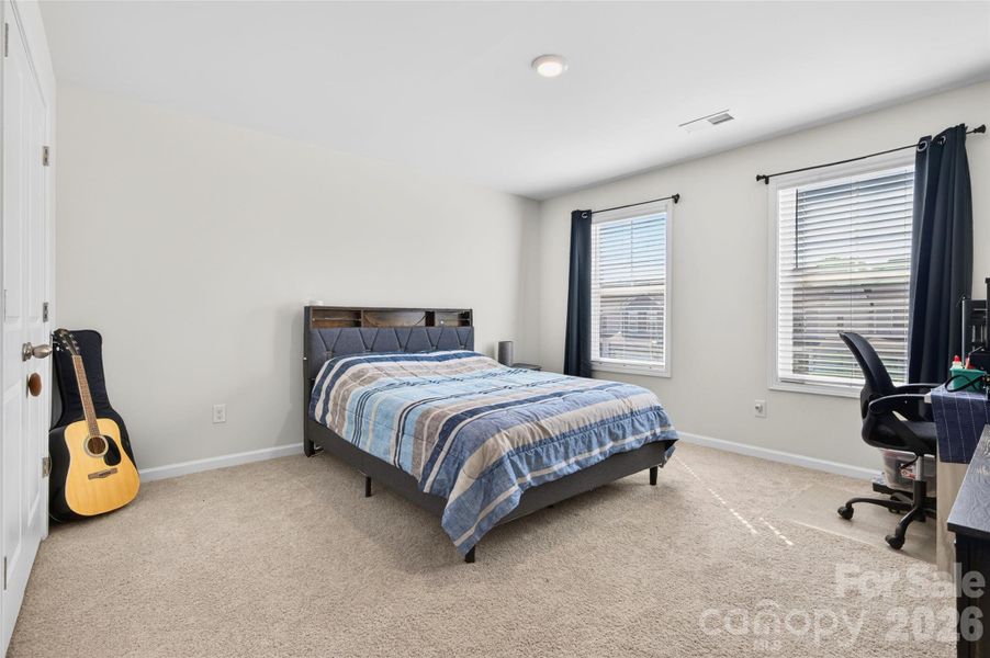 Bedroom 2, spacious with lots of natural light.